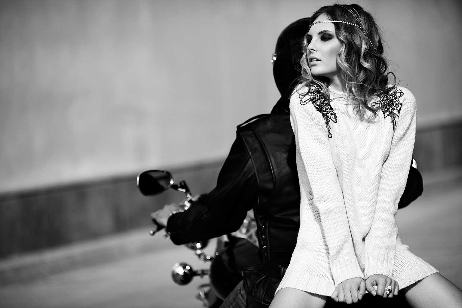 Woman Facing Backwards on a Motorcycle